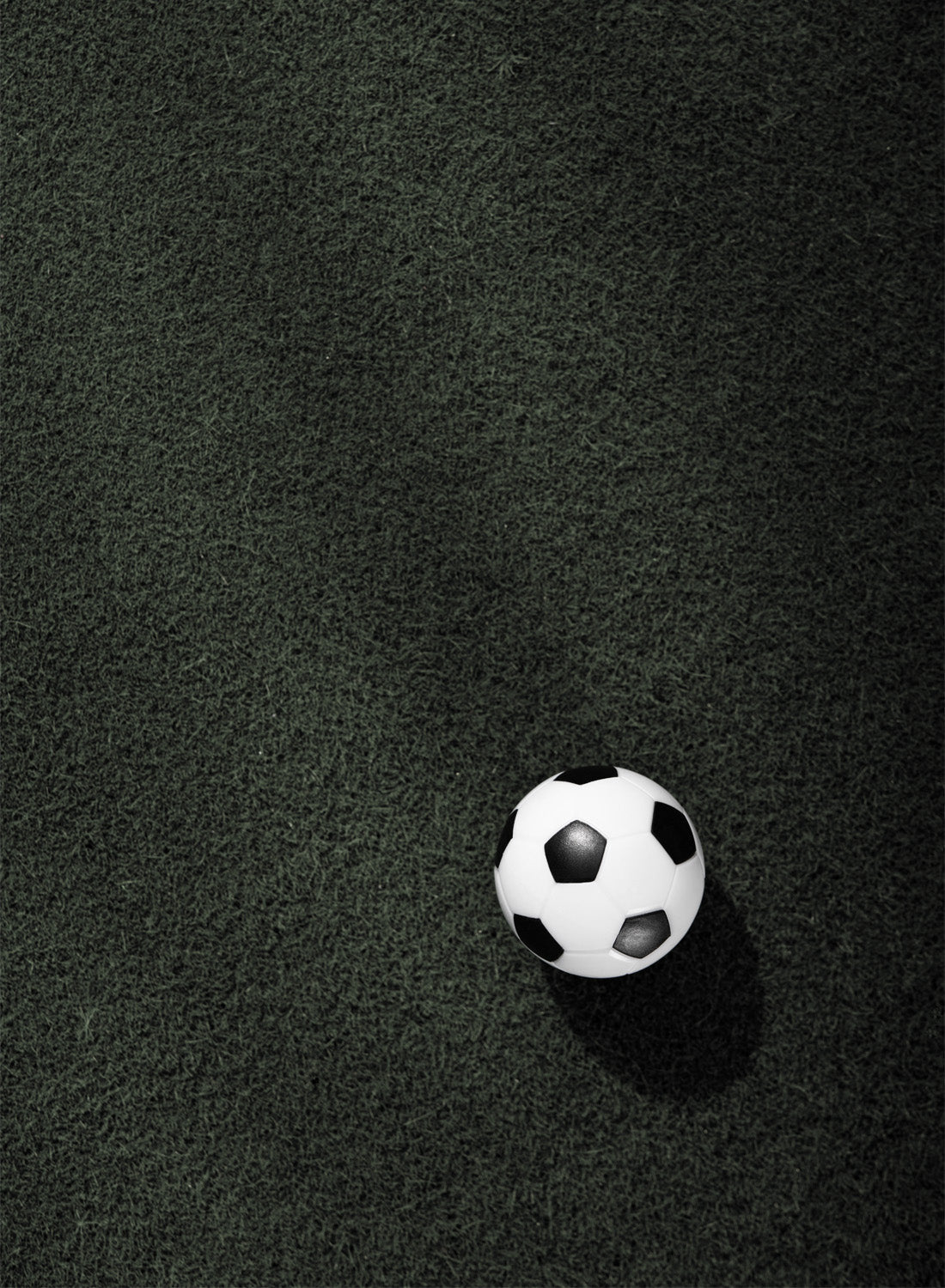 FOOTBALL ON GRASS FIELD